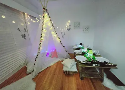 a room with a tent in the corner of a room at Private 2 BR Cozy Home Private Parking Free Sparkling and Goodies! 4 mins from Metrotown in Burnaby