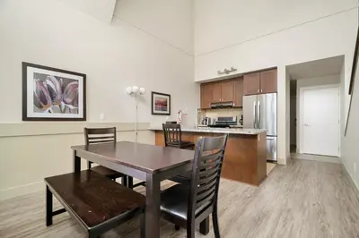 a kitchen and dining room with a table and chairs at Harrison 3BR Pet friendly Unit in Harrison Hot Springs