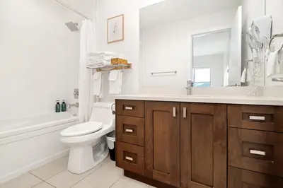 a bathroom with a sink and a toilet and a bath tub at 4BR Unit In The Heart Of Harrison in Harrison Hot Springs