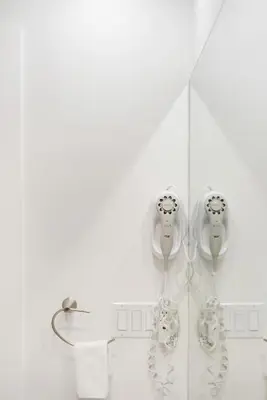 a bathroom with two hair dryers and a shower at 4BR Unit In The Heart Of Harrison in Harrison Hot Springs