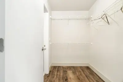 an empty room with white walls and wooden floors at Serenity Luxe 2BR unit in Harrison in Harrison Hot Springs