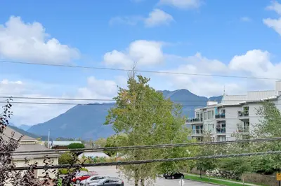 a view of the mountains from a city at Chic Haven Stylish 3Bedroom in Harrison Hot Springs
