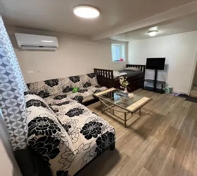 a living room with a couch and a coffee table at Nanaimo Nest in Nanaimo