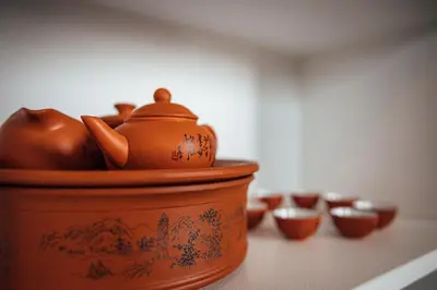 an orange pot sitting on a counter with other cups at Elowen Suites Downtown in Drumheller