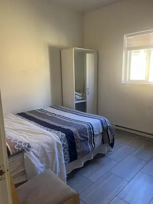 a bedroom with a bed and a mirror at one private room in Victoria
