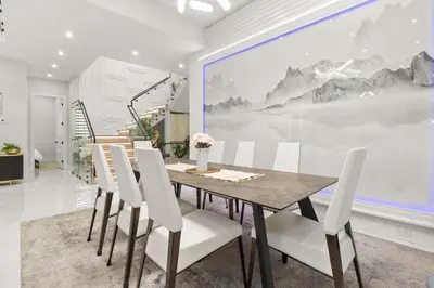 a dining room with a table and white chairs at Spacious 6BR Entire Home Sleeps 14 Private Parking Pet-Friendly Near Vancouver in Surrey