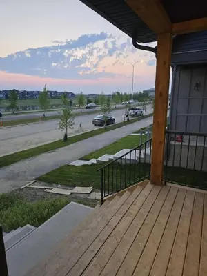 a porch of a building with a view of a street at Modern Comfort - With AC in Calgary