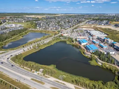 an aerial view of a city with two reservoirs at Two Bedroom Townhouse with AC Garage Parking and Wifi in Calgary
