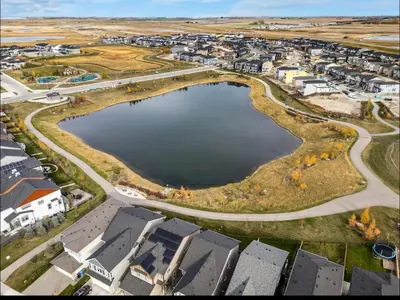 an aerial view of a town with a large body of water at Brand new suite with parking pad at the back in Calgary