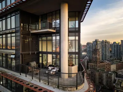 an apartment building with a view of a city at 3-Level Modern Luxury Sub-Penhouse, Best Ocean & City Views - Prime Downtown Location in Vancouver