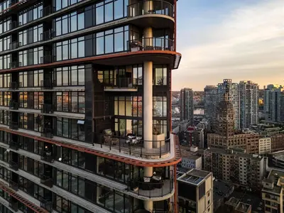 a tall building with a balcony on top of it at 3-Level Modern Luxury Sub-Penhouse, Best Ocean & City Views - Prime Downtown Location in Vancouver