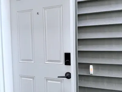 a white door in a book shelf at Cozy 2BR Basement Rosenthal Stay by WEM with private entrance in Edmonton