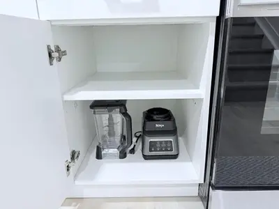 a kitchen cabinet with a blender in it at Cozy 2BR Basement Rosenthal Stay by WEM with private entrance in Edmonton