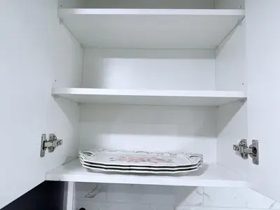 a white kitchen with two faucets and a shelf at Cozy 2BR Basement Rosenthal Stay by WEM with private entrance in Edmonton