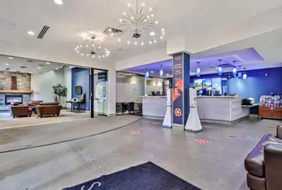 a lobby of a store with couches and a counter at Amazing mountain Views 3BR Penthouse with private Balconies in Canmore