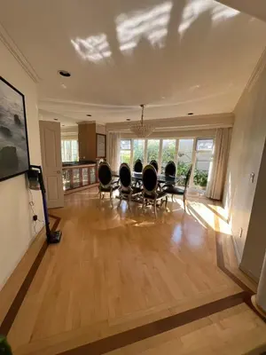a large living room with chairs and a table at Luxurious and quiet room in Vancouver's West End in Vancouver