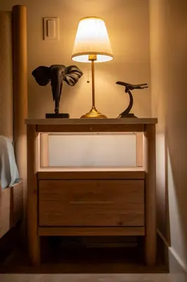a lamp on a dresser with a lamp on it at Modern Luxury Stay - Airport, Banff, Rockies Route in Calgary