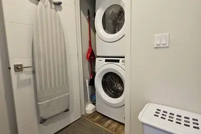 a laundry room with a washing machine and a washer at Cloudline Vista 3 BdrmTownhouse with Garage managed by Little Sister Getaways in Canmore