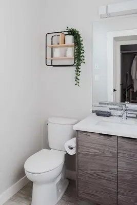 a white bathroom with a toilet and a sink at NordicSauna 3 Ensuite baths TheYellowDoorRetreat in Edmonton