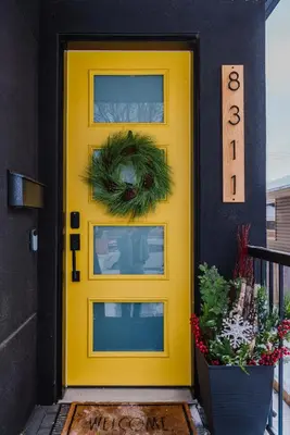 a yellow front door with a wreath on it at NordicSauna 3 Ensuite baths TheYellowDoorRetreat in Edmonton