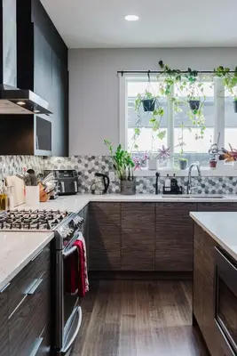 a kitchen with a sink and a window with plants at NordicSauna 3 Ensuite baths TheYellowDoorRetreat in Edmonton