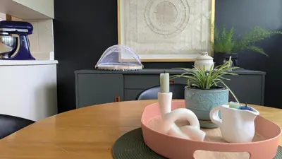 a table with a pink bowl on top of it at YEGFamilyHome in Edmonton