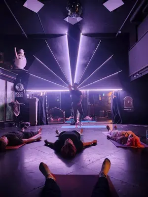 a group of people laying on the floor in a stage at Trout House by Trout Lake in Vancouver