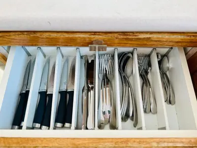a drawer full of forks and spoons at 4BR 2BA Downtown-View Cozy House with Parking, Pet-Free in Vancouver