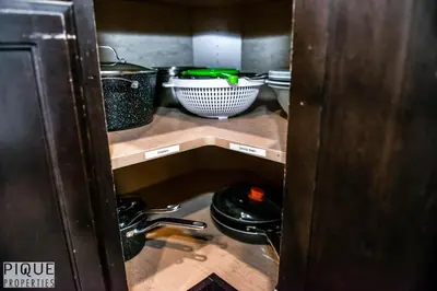 a kitchen with a sink and some pots and pans at 5BD Jungle Oasis - HotTub - BBQ - King Bed - Games - Garage in Edmonton