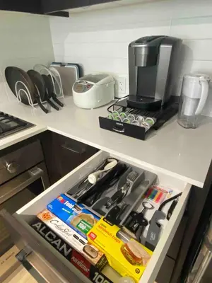a drawer in a kitchen filled with lots of items at Cozy Richmond Center Downtown 2B & 2B Apartment in Richmond