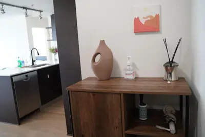 a vase sitting on top of a table in a kitchen at Cozy Richmond Center Downtown 2B & 2B Apartment in Richmond