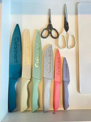 a bunch of pairs of scissors hanging on a wall at Modern Cozy Entire Guest Suite in Central Edmonton in Edmonton