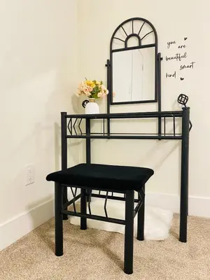 a black bench in a room with a mirror at Modern Cozy Entire Guest Suite in Central Edmonton in Edmonton