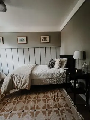 a bedroom with a bed and a table in it at Wilder Lodge in Fairmont Hot Springs