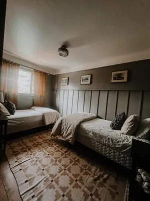 a bedroom with two beds and a window at Wilder Lodge in Fairmont Hot Springs
