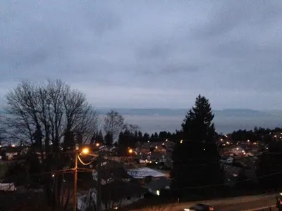 a view of a city at night with lights at Tide and Rose Garden in Nanaimo