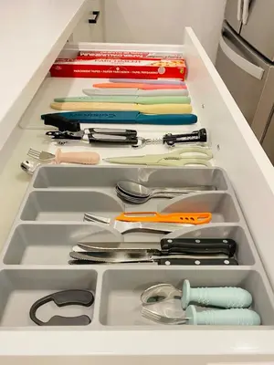 a drawer filled with lots of utensils at The Private Central Edmonton Suite - Comfortable & Fully-Equipped Basement Suite in Edmonton