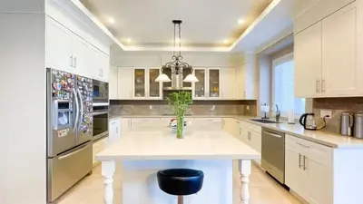 a kitchen with a white table and a vase on it at #3 Room in Richmond