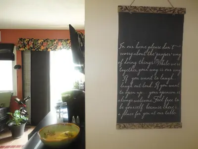 a sign hanging on a wall in a kitchen at Vintage Merlot Bed and Breakfast in Oliver