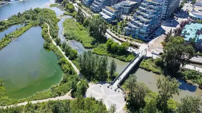 an aerial view of a river and buildings at Riverside Retreat - FREE Banff Pass, Gym, Parking! in Calgary