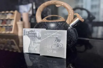 a black tea kettle with a card on it at Summit Mountain & Skyline Views Beltline in Calgary