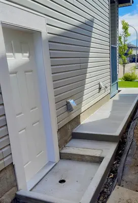a white door on the side of a house at Lucas in Edmonton