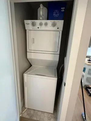 a white washer and dryer in a room at Modern One-Bedroom Retreat in Bear Mountain in Langford