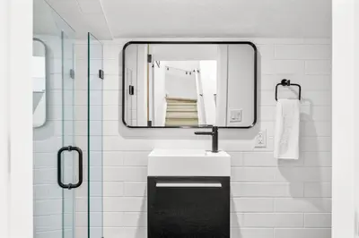 a bathroom with a sink and a mirror at 3BR Escape BBQ, Balcony, Near Banff & DT in Canmore