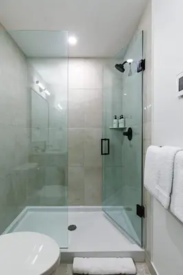a bathroom with a shower and a toilet at Aurora Luxe - Stunning Townhouse Private Hot Tub in Canmore