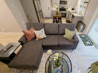 a living room with a couch and a table at Oakview Hideaway in Victoria