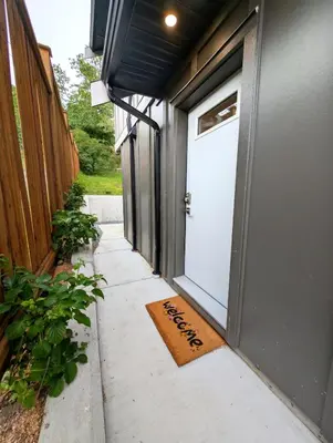 a door with a welcome mat in front of it at Oakview Hideaway in Victoria