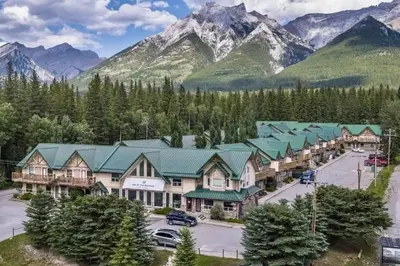 an aerial view of a resort with mountains in the background at banff woods lodge in Canmore