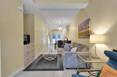 a living room with a couch and a tv at banff woods lodge in Canmore