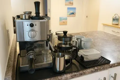 a kitchen with a coffee maker on a counter at Melrose Place Poolside Hideaway Heated Pool All Year Ideal for Groups Sleeps 6 plus in Victoria